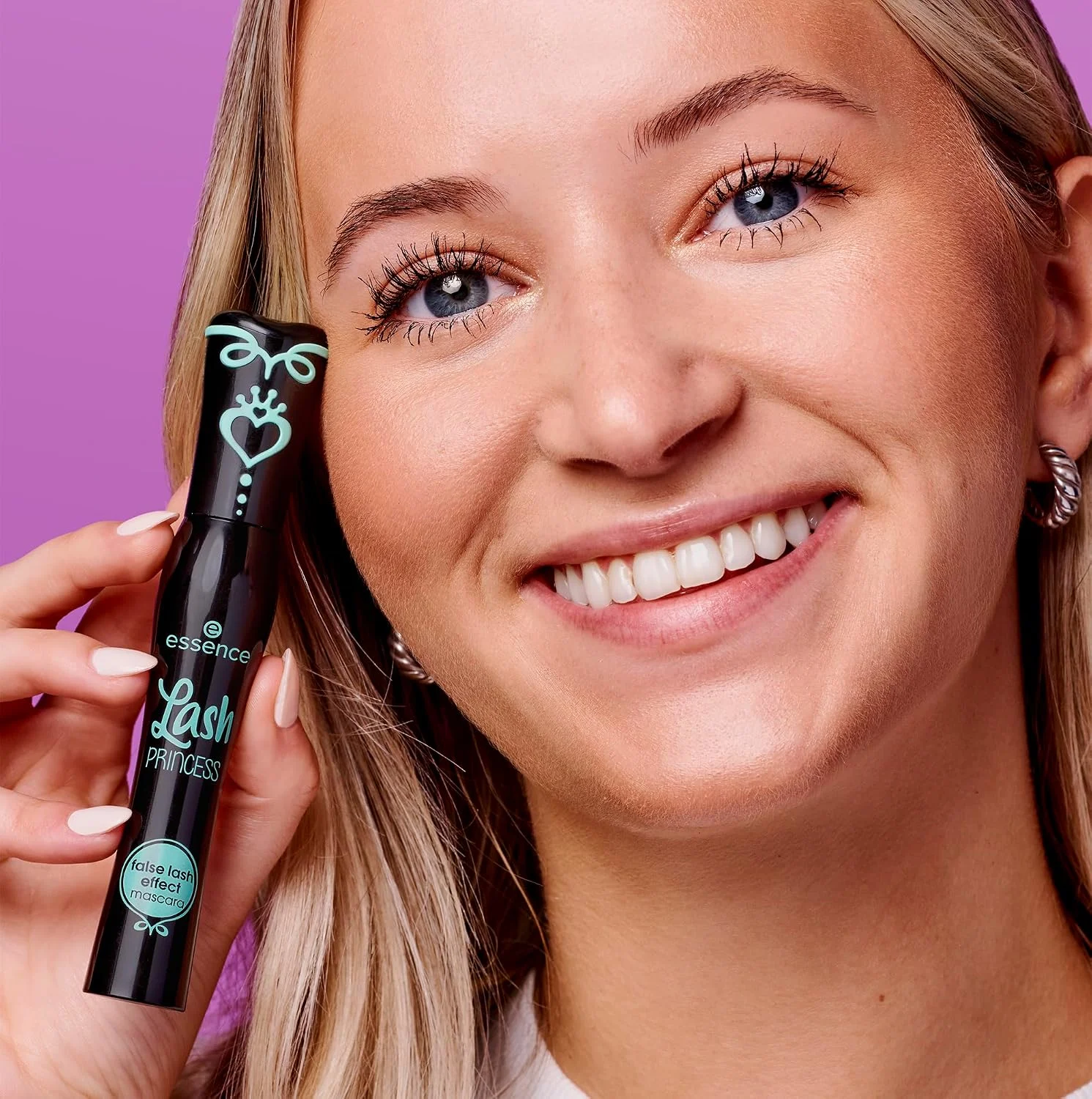 Model holding Essence Lash Princess False Lash Effect Mascara